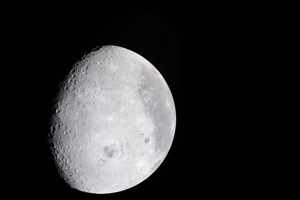 A high-resolution view of Earth's Moon showcasing its dark Maria and bright, heavily cratered highlands